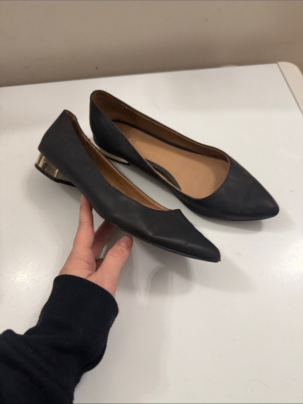 Classic Black Pointed Toe Women's Flats with Metallic Heel Accent